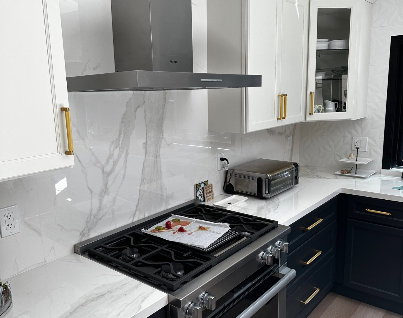 Counter Top Services San Francisco Bay Area, Homeowner enjoying updated budget-friendly kitchen with new cabinets and bright countertops, Contractor measuring kitchen layout and reviewing cost-effective renovation plans with homeowner, Skilled remodeler measuring premium kitchen layout for custom cabinetry and lighting plan