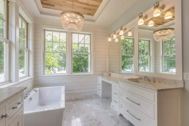 Contractor installing new shower tile and vanity in compact Hayward family bathroom, New walk-in shower and double vanity installed in a San Ramon primary bathroom