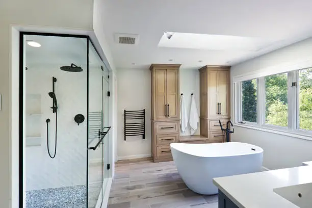 Experienced bathroom remodeler checking wall alignment and fixture placement before installation, Bathroom Remodeling in Antioch