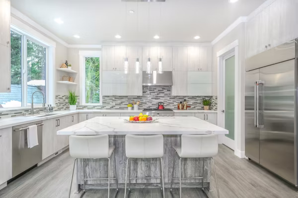Contractor aligning new kitchen cabinets during organized home renovation project